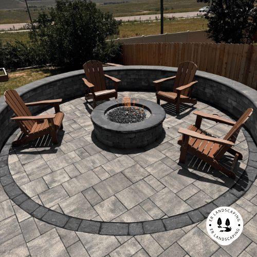Built-in fire pit with pavers and integrated seating wall — Brighton CO — ER Landscaping