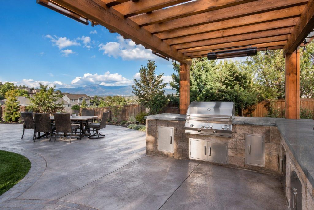 Covered grill station with pergola — separate cooking and dining zones — Brighton CO